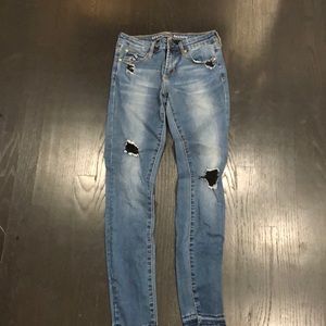 Articles of society denim w black shredd patches. Size 25